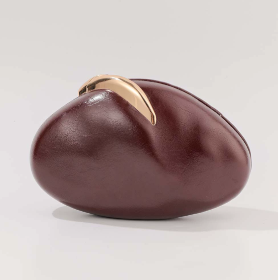 blush oval clutch with sculpted gold handle – BLUSHÉ