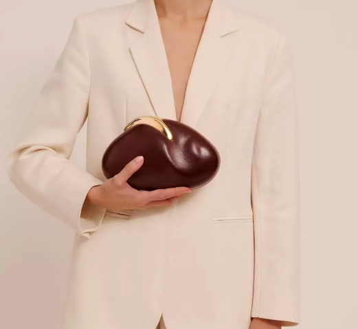 blush oval clutch with sculpted gold handle – BLUSHÉ