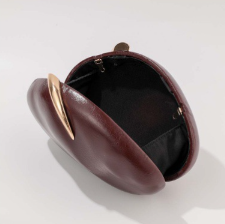 blush oval clutch with sculpted gold handle – BLUSHÉ