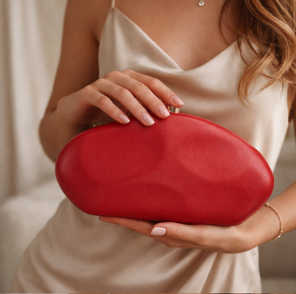 python-effect oval clutch with metallic clasp – VESPER