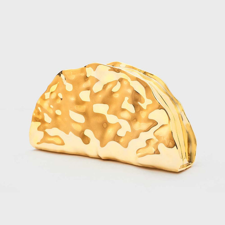 sculpted metallic clutch with abstract cutout design – NOIRÉP