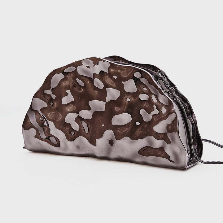 sculpted metallic clutch with abstract cutout design – NOIRÉP