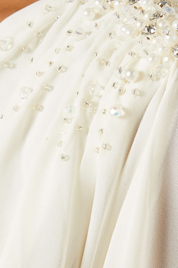 فستان منفوش مع أكتاف مزينة – عاجي