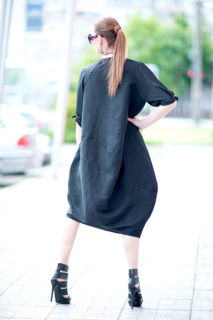 فستان ماكسي على نطاق واسع من الكتان مع جيب الساتان